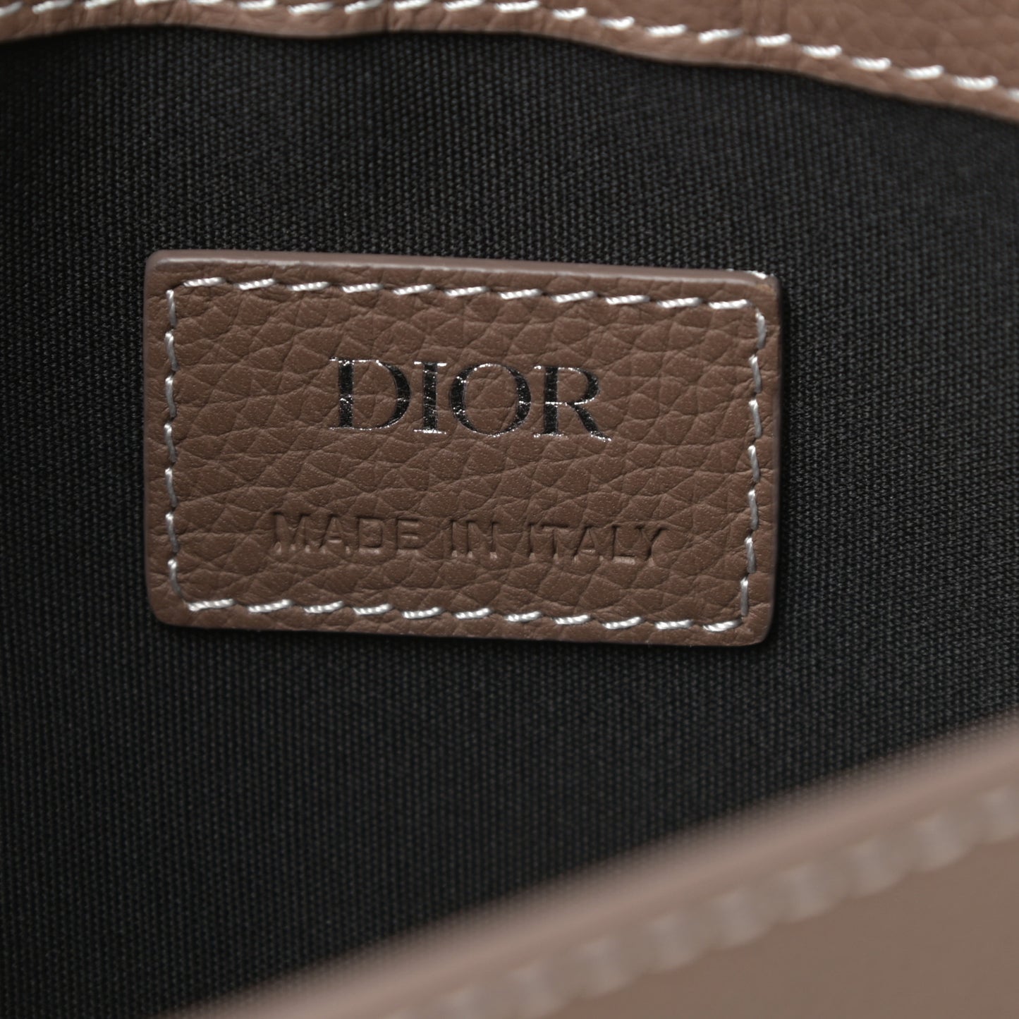 X KAWS Grained Calfskin Saddle Pouch Marron Multicolor