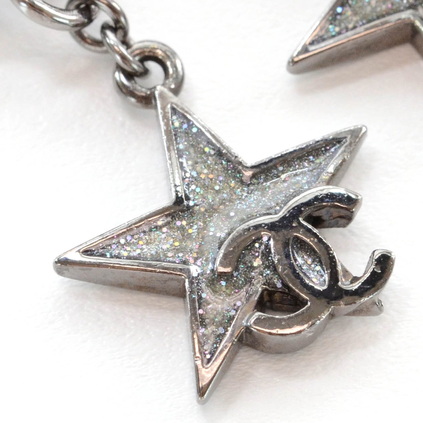 Glitter CC Star Drop Clip On Earrings Silver
