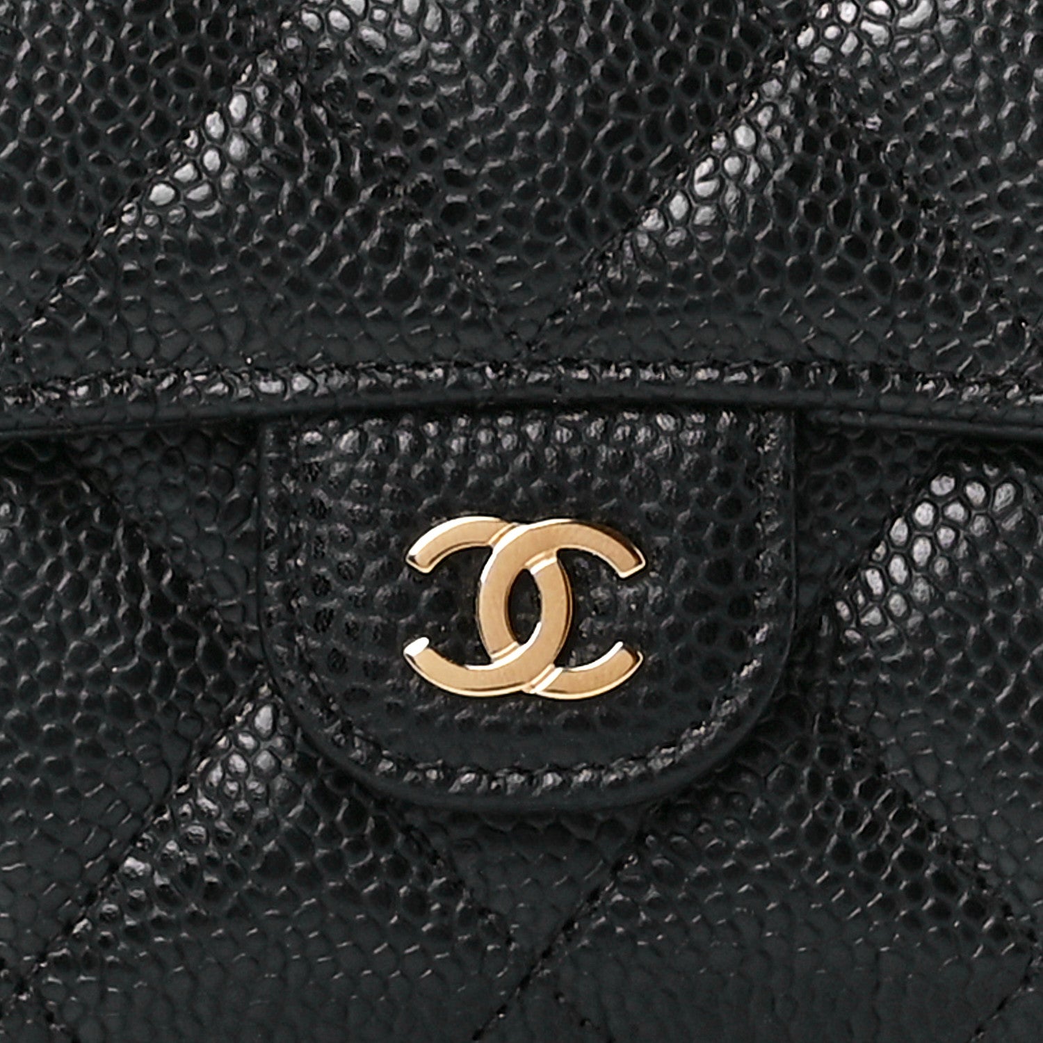 close up image of chanel caviar leather in black by FASHIONPHILE