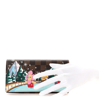 Louis Vuitton Damier Ebene 2023 Christmas Animation Ice Skating Sarah Wallet Pink 2 of 7