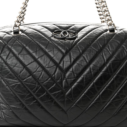 Chanel Aged Calfskin Chevron Quilted Duffle Bag Black 8 of 10