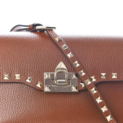 Valentino Garavani Pebbled Calfskin Medium Rockstud Flip Lock Crossbody Bag Bright Cognac 9 of 9