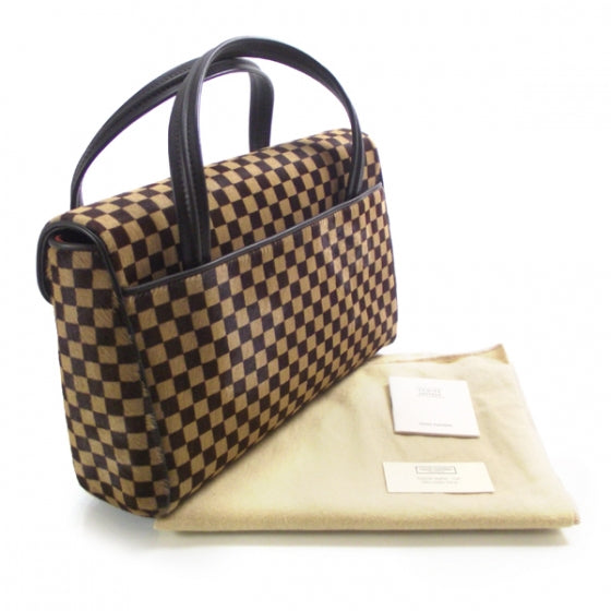 Damier Sauvage Lionne