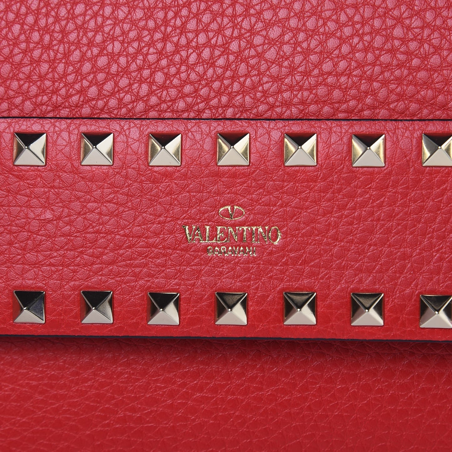 Pebbled Calfskin Rockstud Side Slip Crossbody Rouge Pur