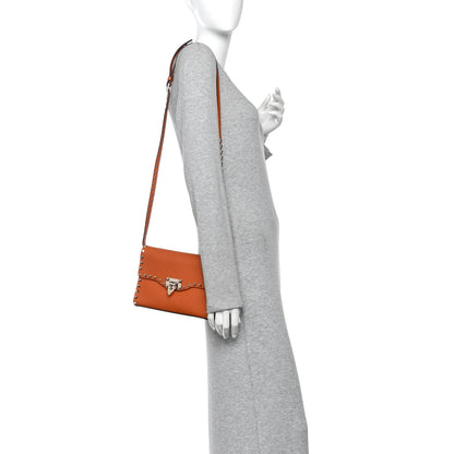 Valentino Garavani Pebbled Calfskin Medium Rockstud Flip Lock Crossbody Bag Orange 2 of 12