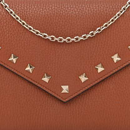 Valentino Garavani Pebbled Calfskin Rockstud Envelope Wallet on Chain Bright Cognac 7 of 10