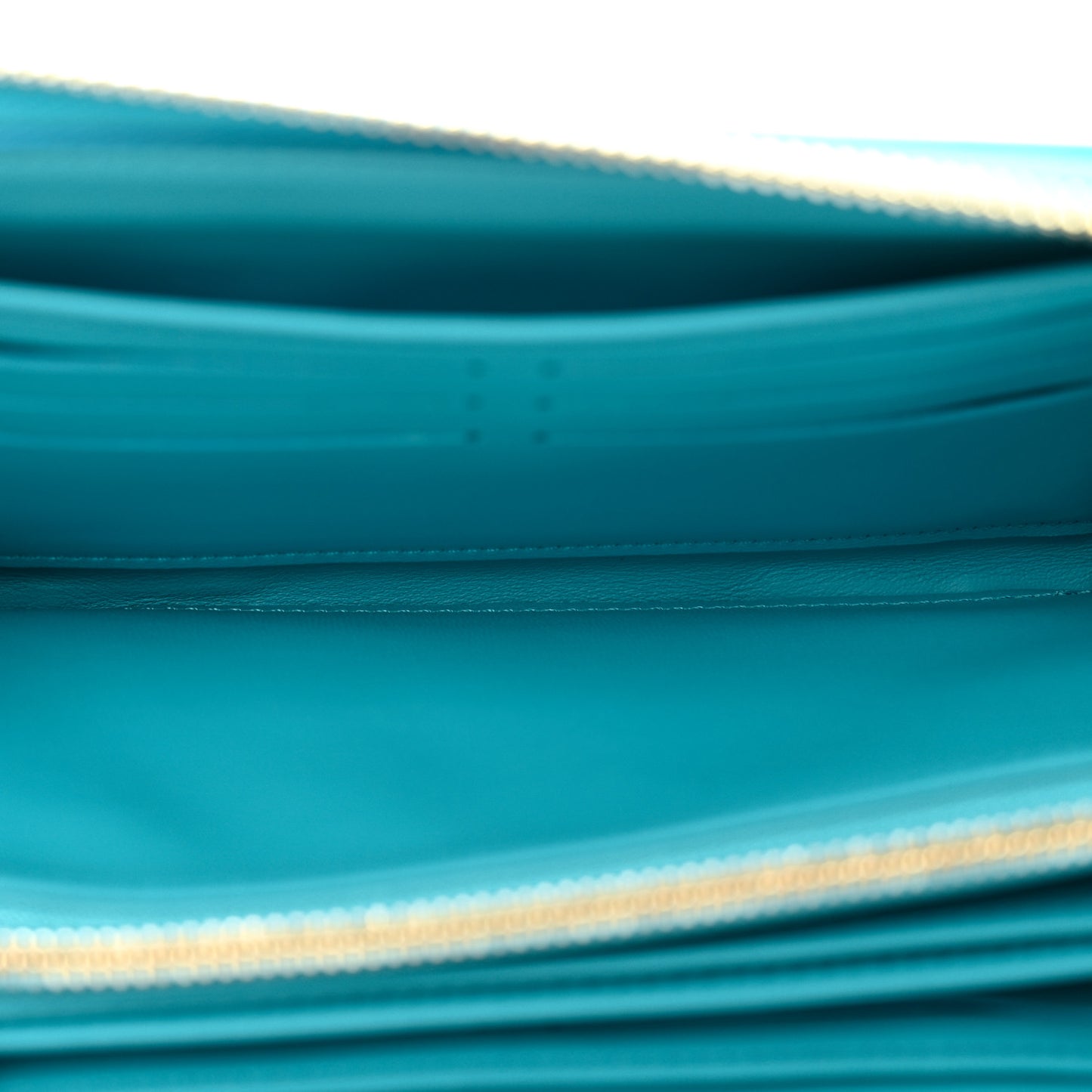 Lambskin Embossed Monogram Coussin Zippy Wallet Turquoise