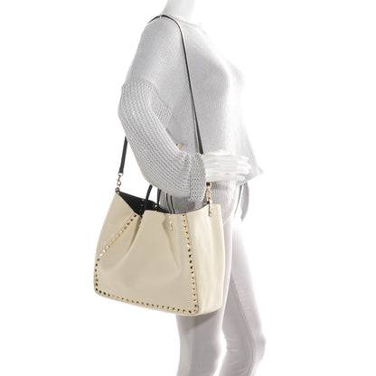 Valentino Garavani Grained Calfskin Medium Rockstud Reversible Tote Black Ivory 2 of 7