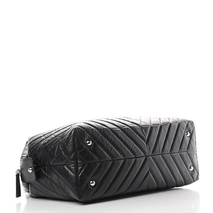Chanel Aged Calfskin Chevron Quilted Duffle Bag Black 4 of 12