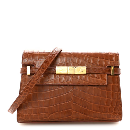 Saint Laurent Shiny Calfskin Crocodile Embossed Small Manhattan Baguette Dark Caramel 1 of 10