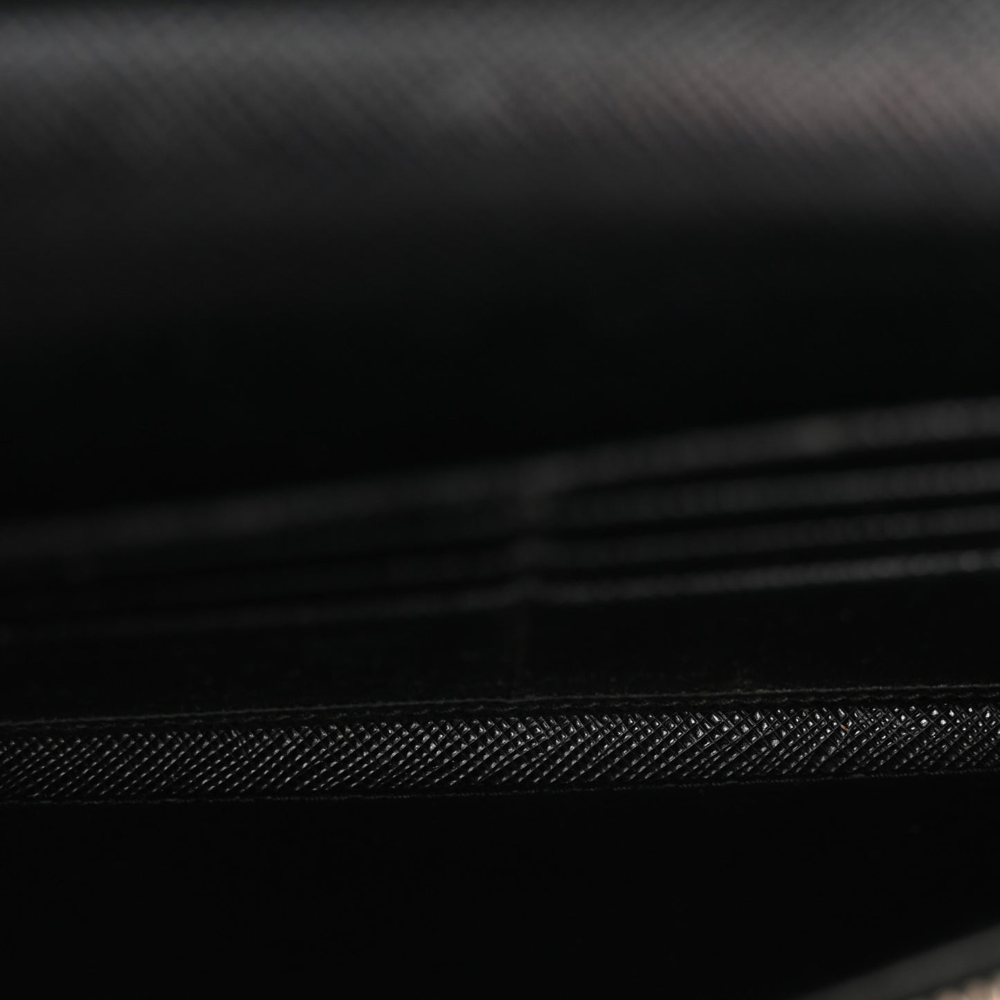 Saffiano Triangle Logo Continental Flap Travel Wallet Black