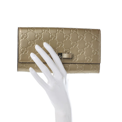 Gucci Metallic Guccissima Signature Bowy Continental Wallet Golden Beige 2 of 7