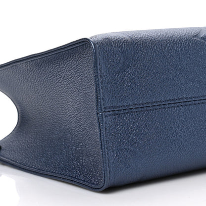 Louis Vuitton Metallic Empreinte Monogram Giant Onthego PM Navy Nacre 7 of 8
