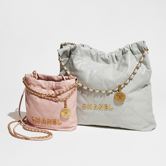studio image of chanel 22 and mini chanel 22 bags side by side to compare size differences FASHIONPHILE