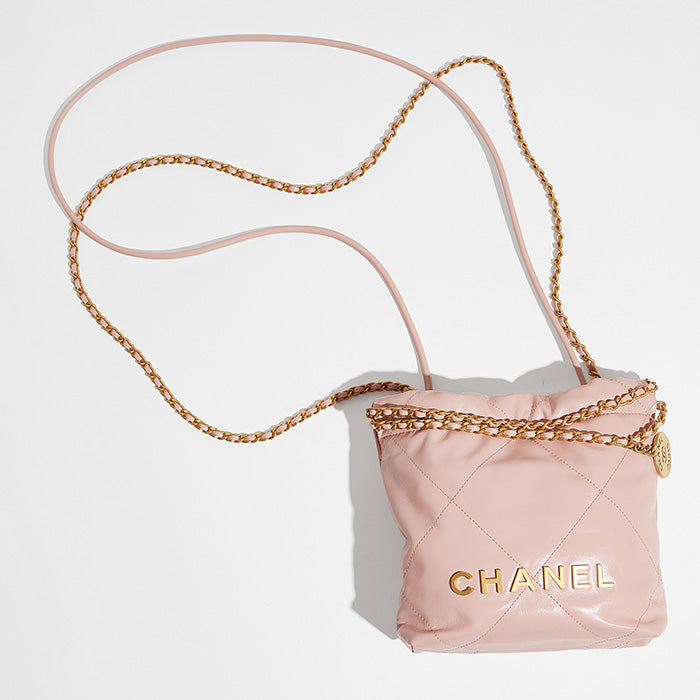 studio image of pink mini chanel 22 bag FASHIONPHILE