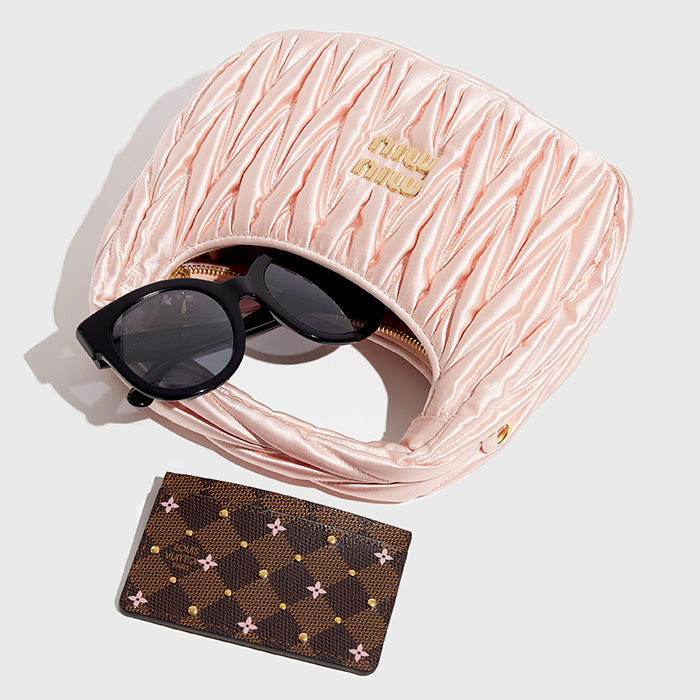 image of what fits inside the mini miu miu wander bag by fashionphile