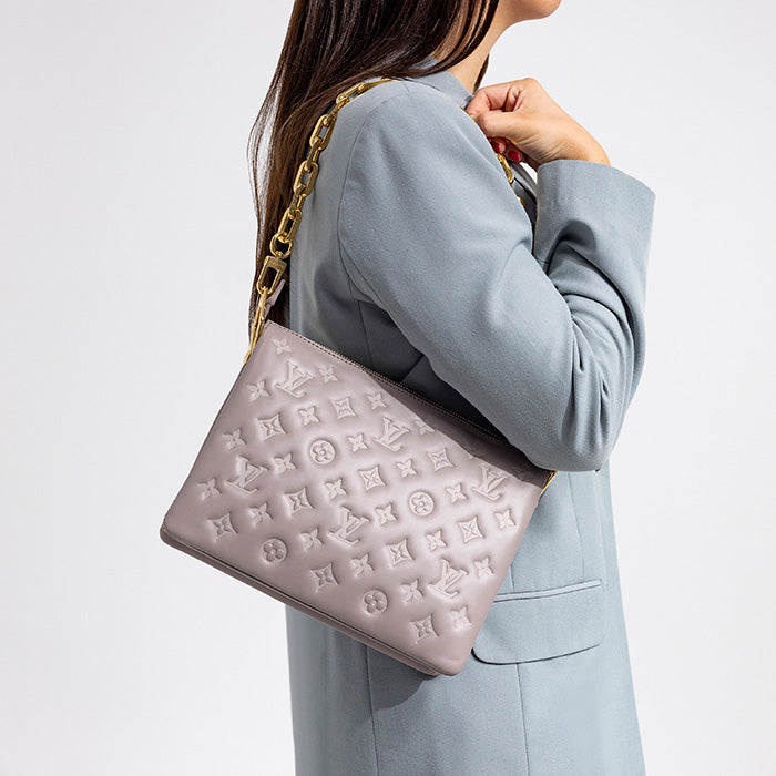 lifestyle of model wearing louis vuitton monogram coussin pm FASHIONPHILE