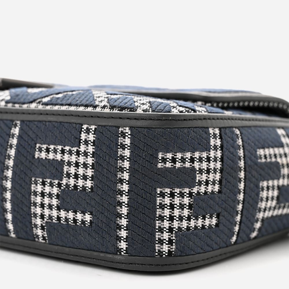 close up image of an authentic fendi baguette with FF logos and houndstooth print by FASHIONPHILE