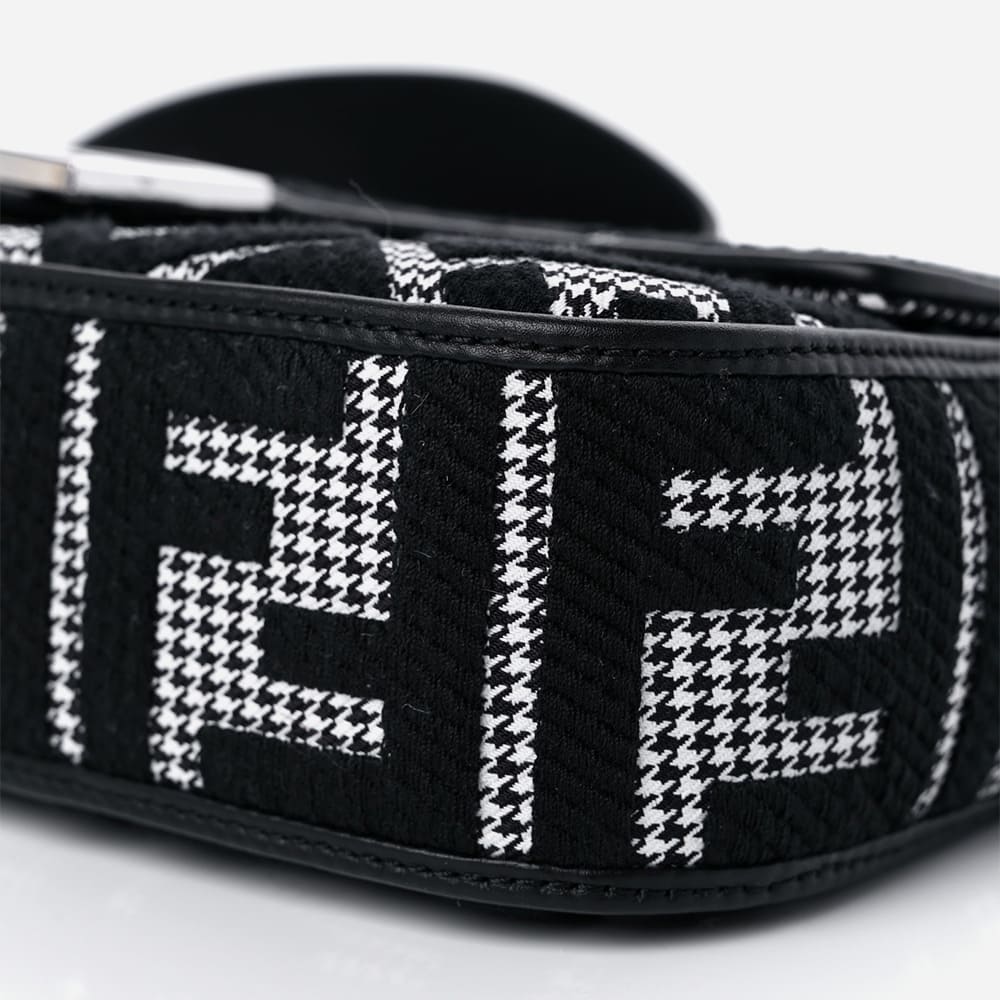 close up image of an fake fendi baguette with FF logos and houndstooth print by FASHIONPHILE