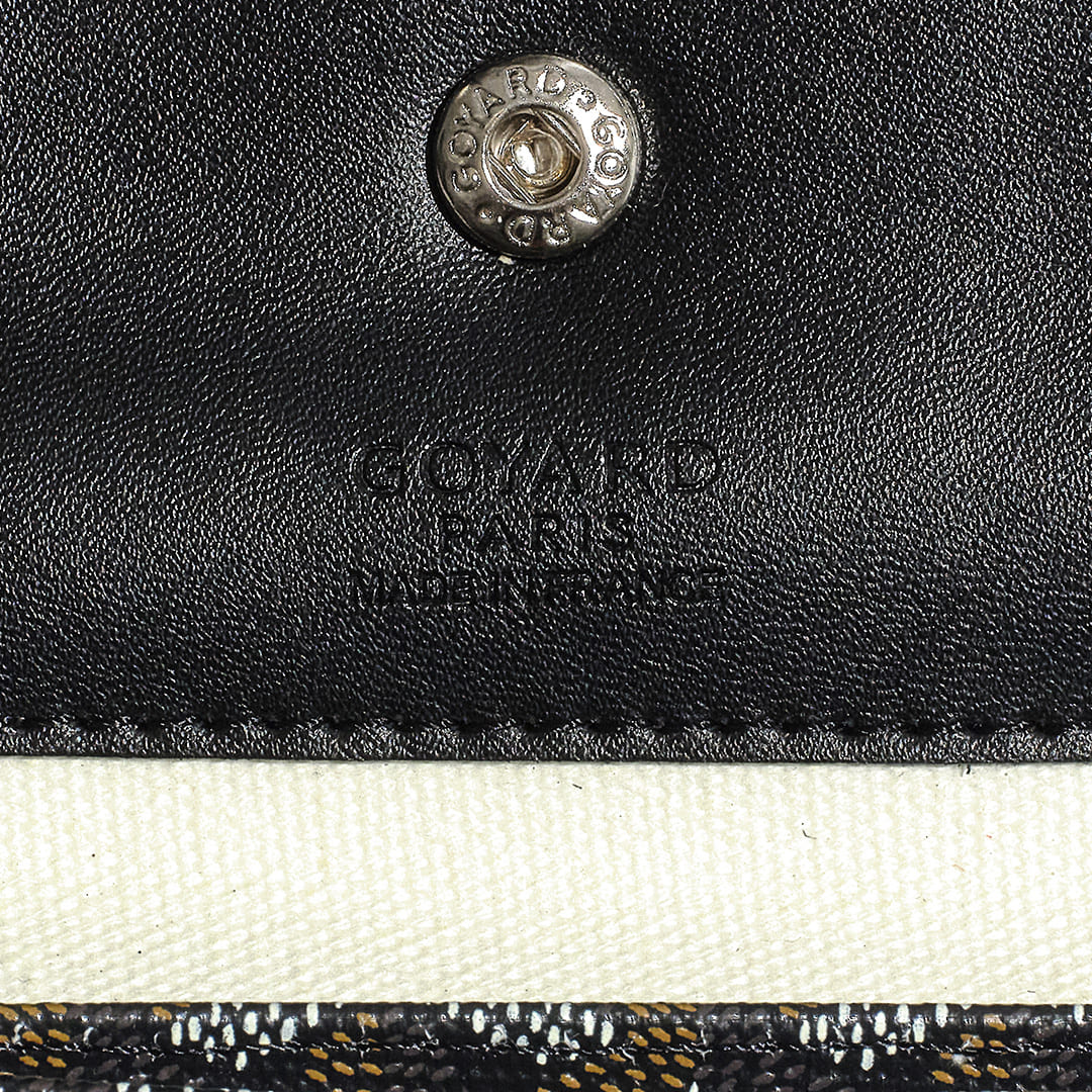 Close up image of a fake Goyard brand logo inside a Saint Louis Tote in Black by FASHIONPHILE