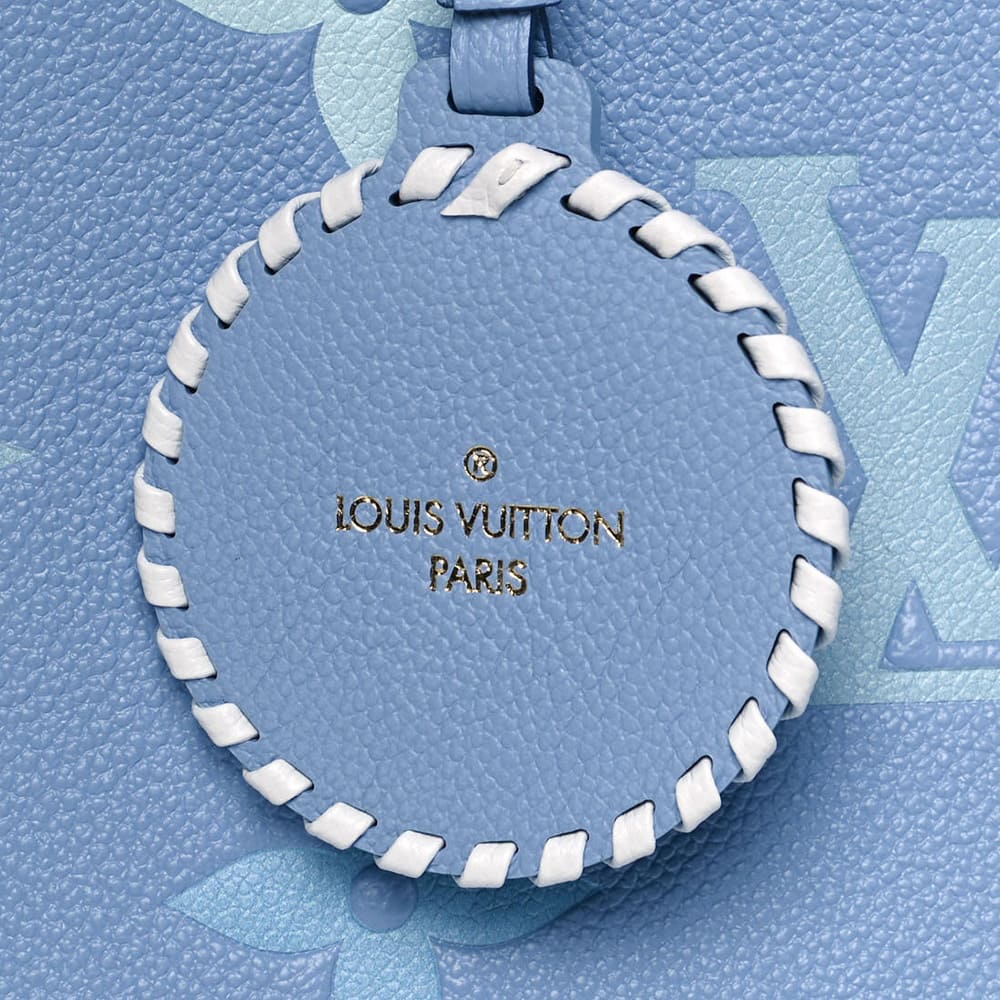 image of authentic louis vuitton onthego bag charm in the color blue by FASHIONPHILE