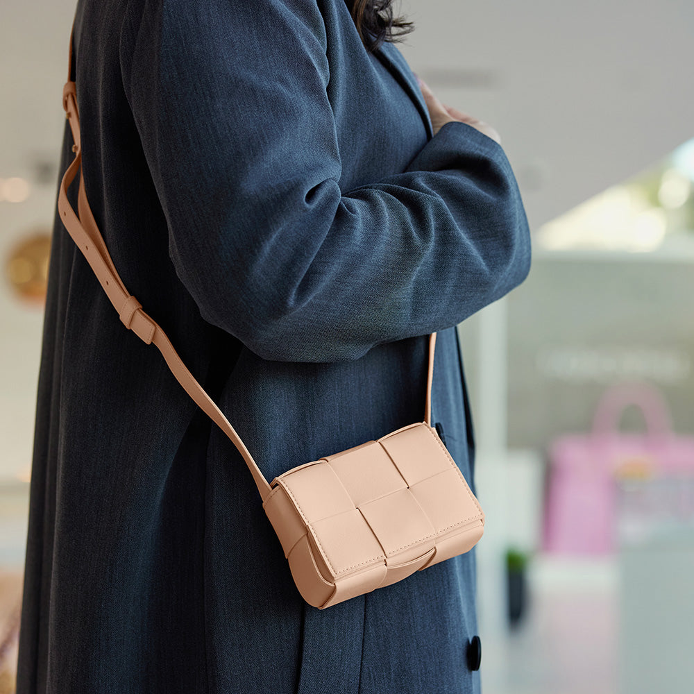 the candy cassette from bottega veneta worn as a crossbody bag by FASHIONPHILE