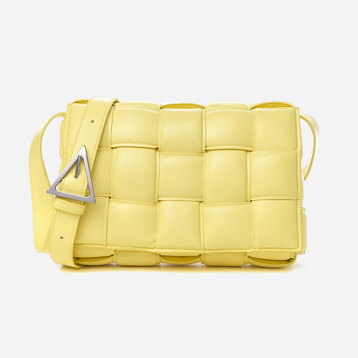 studio image on white of yellow bottega veneta padded cassette bag FASHIONPHILE