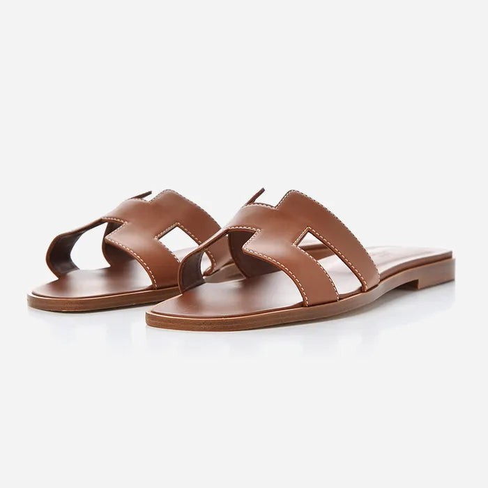 studio image of brown leather oran sandals at fashionphile
