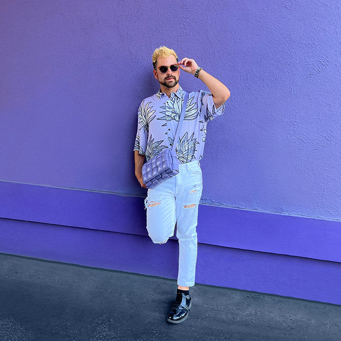 lifestyle image of influencer wearing purple styled with a purple bottega veneta cassette crossbody bag FASHIONPHILE