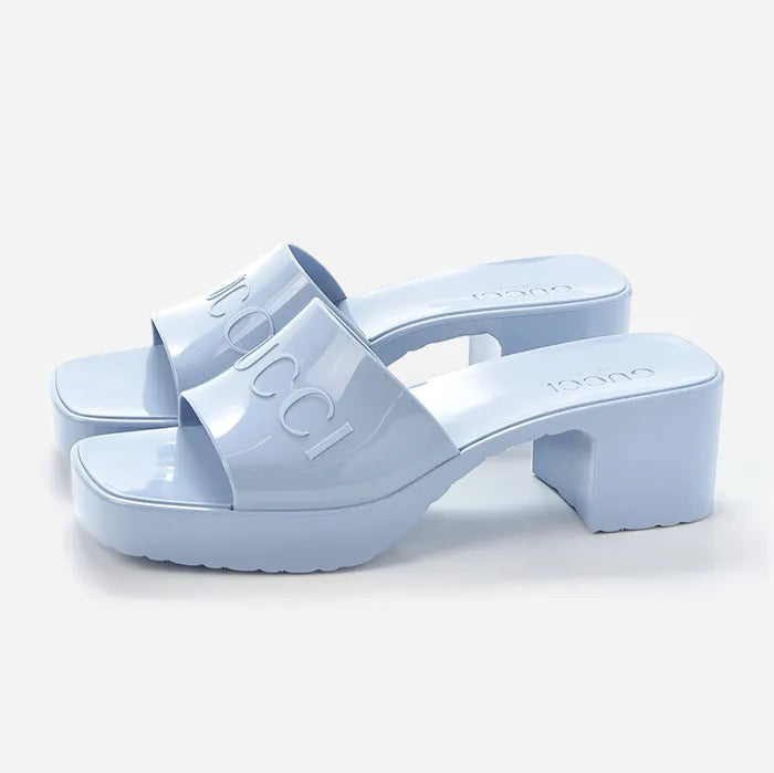 Studio image of gucci rubber logo slide sandals with logo and block heel at fashionphile