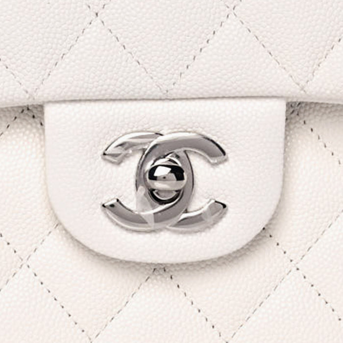 close up image of chanel CC hardware in silver FASHIONPHILE