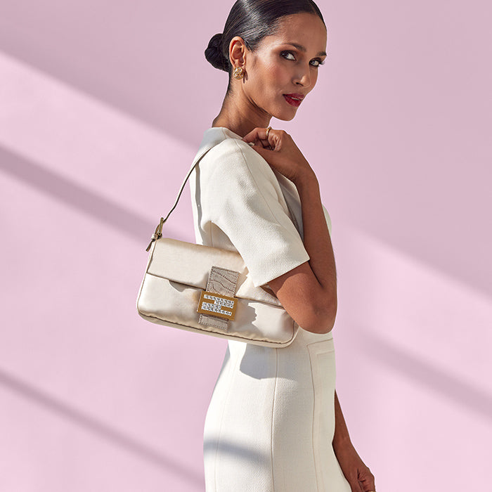 image of model wearing Fendi baguette bag FASHIONPHILE