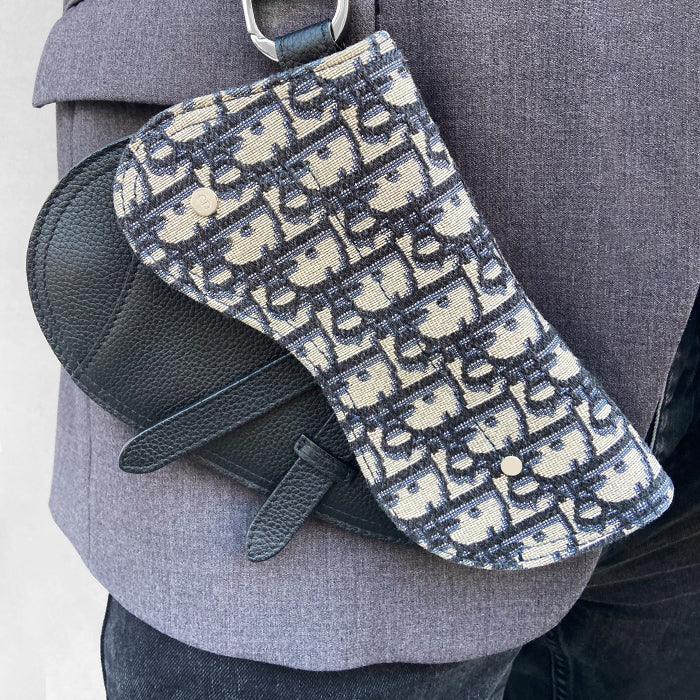 lifestyle image of model influencer wearing Dior saddle wristlet FASHIONPHILE