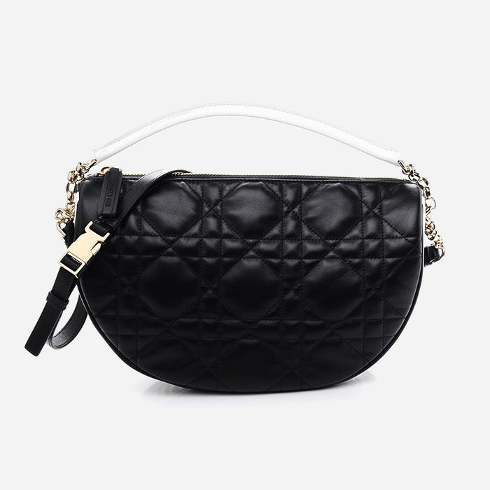 studio image of black and white Dior Vibe Hobo bag at FASHIONPHILE