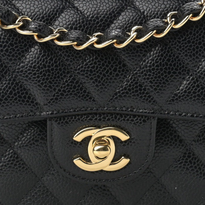close up image of Chanel Double Flap bag in black FASHIONPHILE