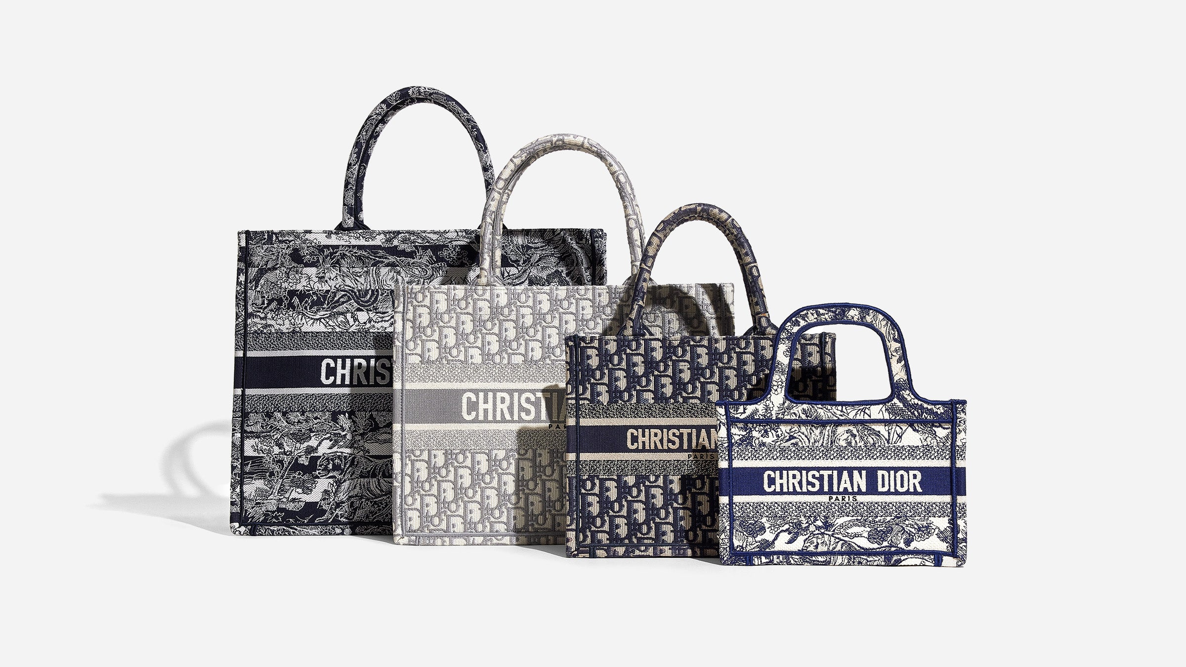 a size comparison of all four christian dior book tote sizes side by side by FASHIONPHILE