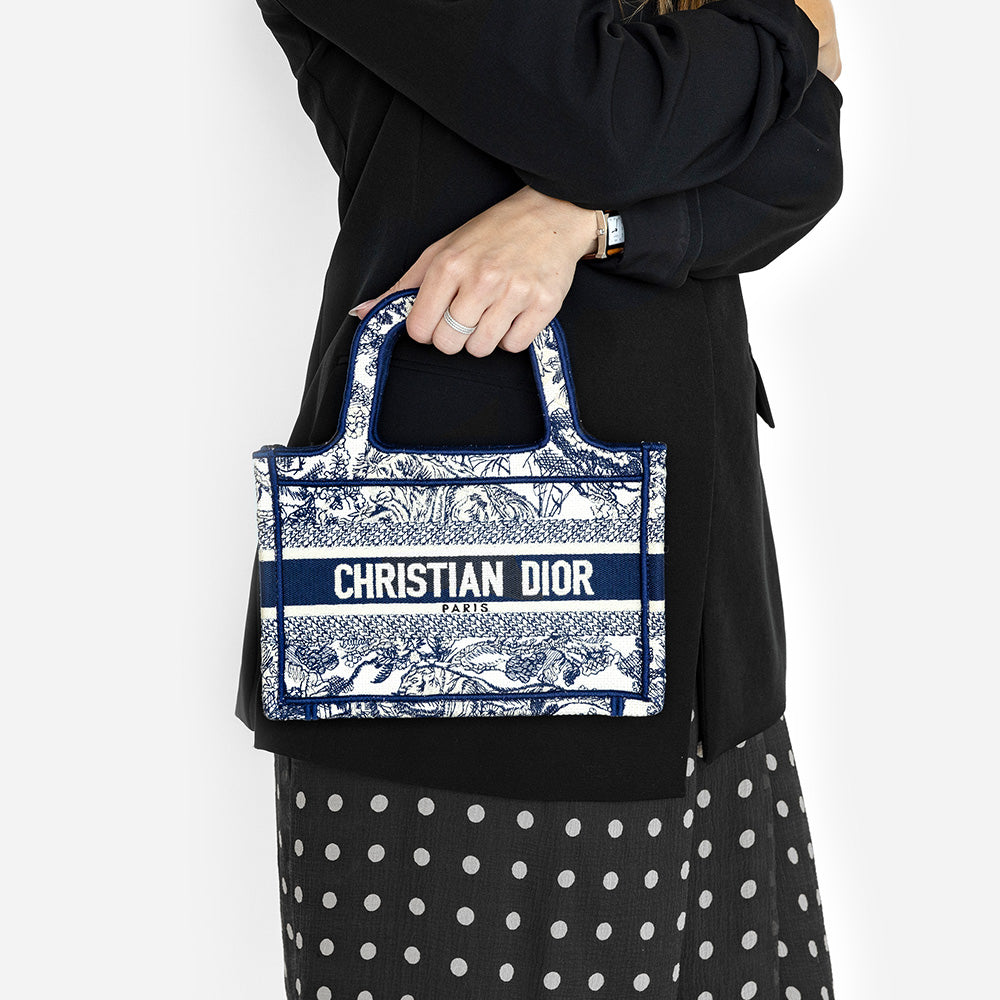 the mini book tote in hand by fashionphile