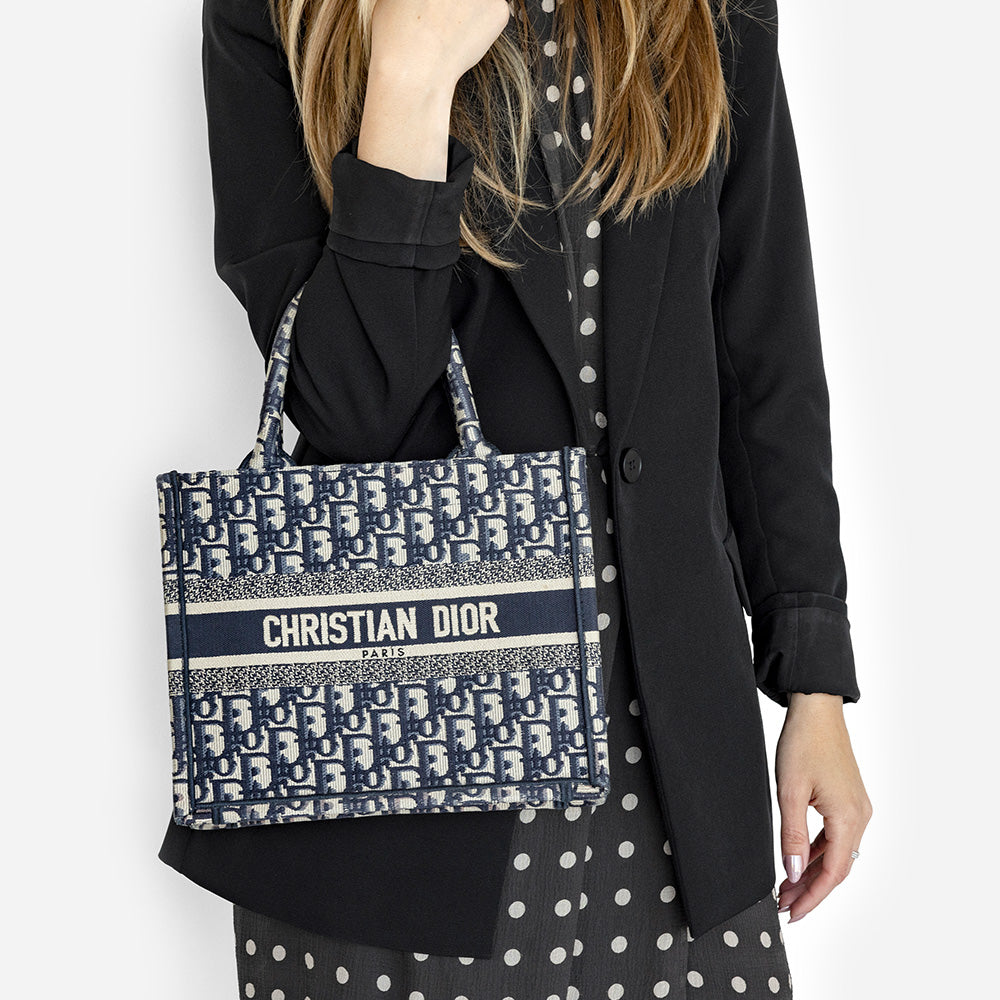 the small book tote worn on the arm by fashionphile
