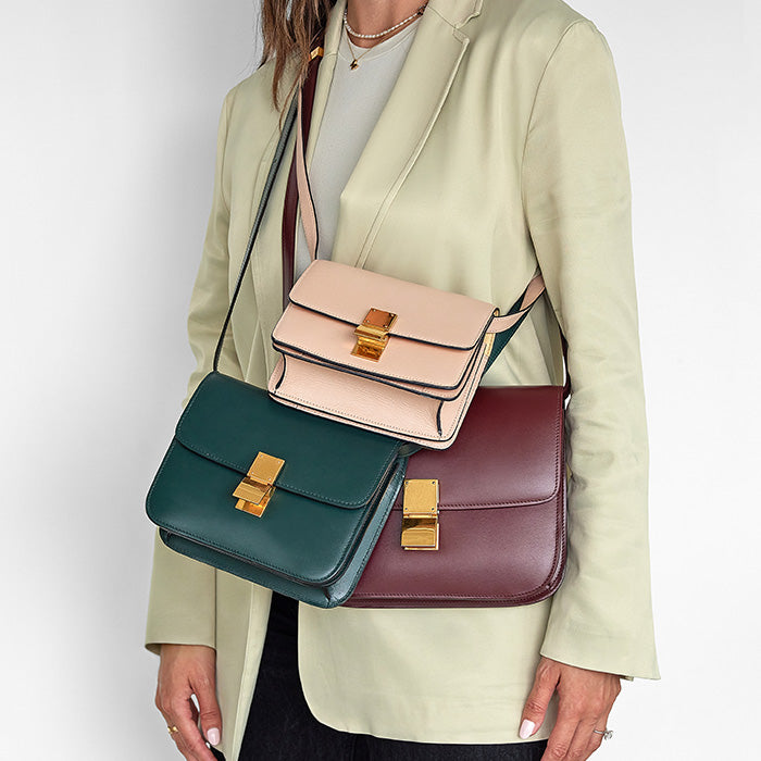 a size comparison of all three celine classic box flap sizes on figure by fashionphile