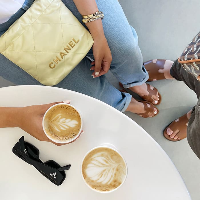 how to style the chanel 22 bag with prada sunglasses and hermes sandals by FASHIONPHILE