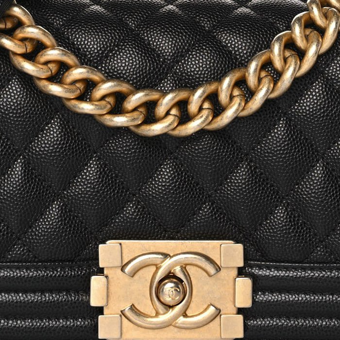 close up image of Chanel Boy bag in black FASHIONPHILE
