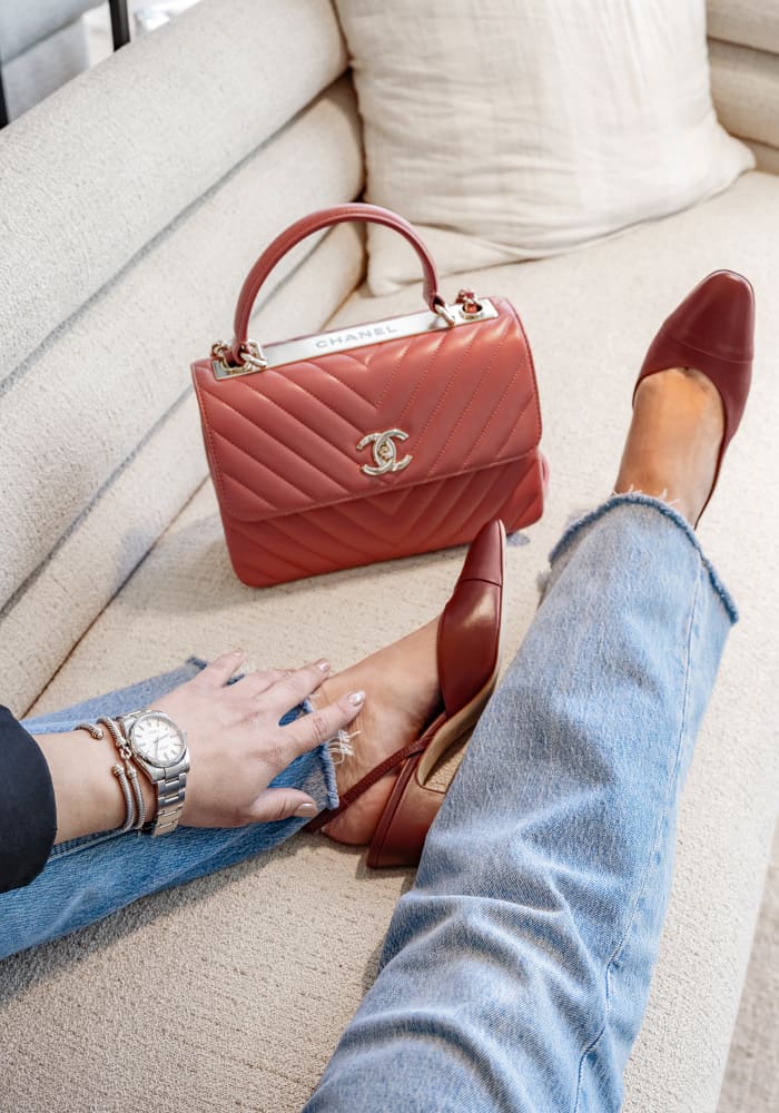 how to style the chanel trendy cc bag showing the chanel tendy cc bag with chanel slingback heels, a rolex watch and david yurman bracelets by FASHIONPHILE