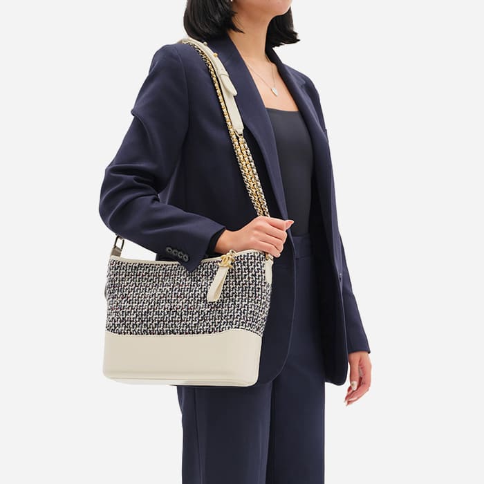 the medium chanel gabrielle hobo size worn as a shoulder bag by FASHIONPHILE