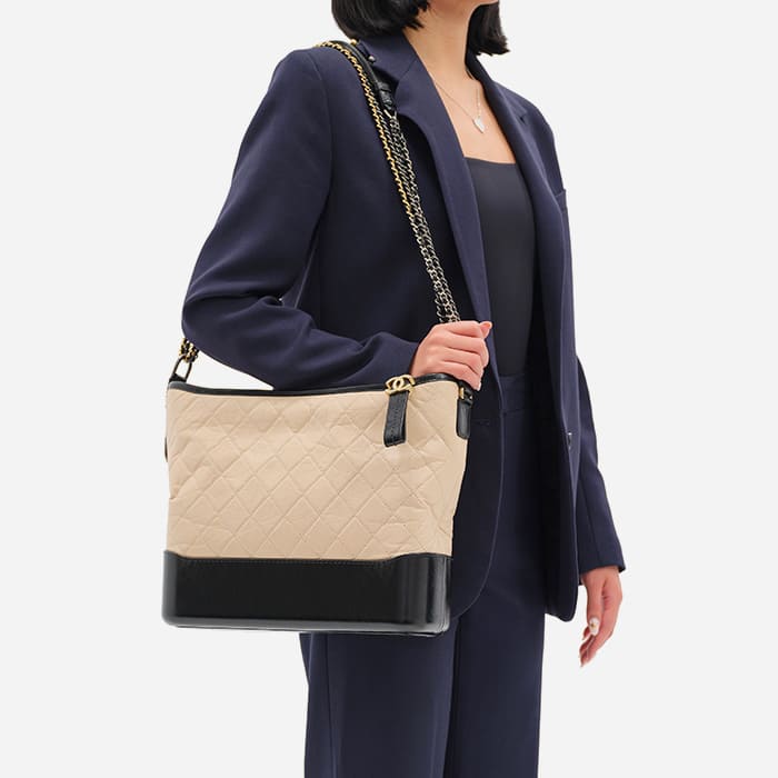 the large chanel gabrielle hobo size worn as a shoulder bag by FASHIONPHILE