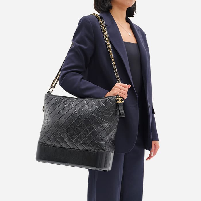 the maxi chanel gabrielle hobo size worn as a shoulder bag by FASHIONPHILE