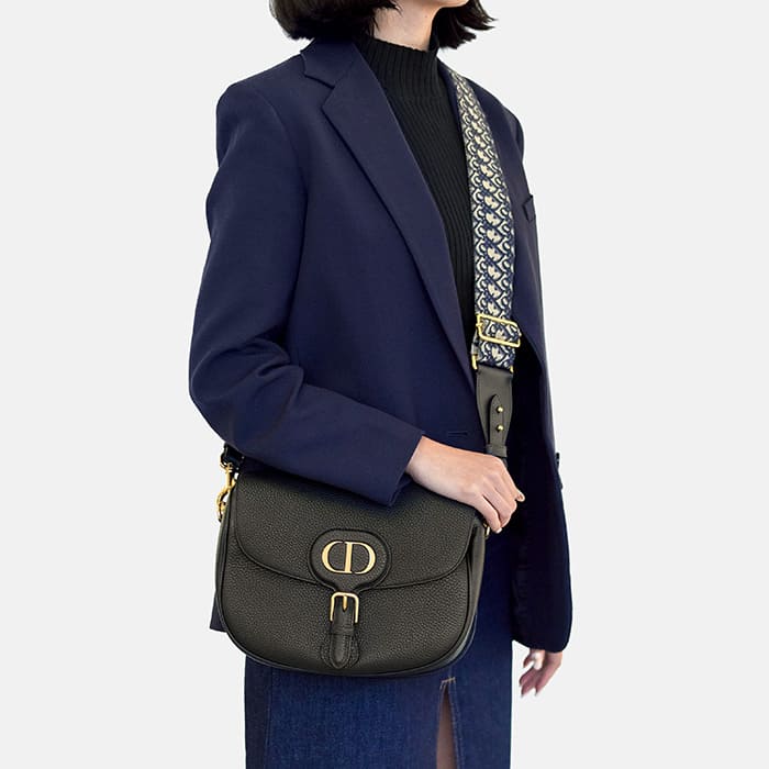 large black leather christian dior bobby bag worn as a crossbody by FASHIONPHILE