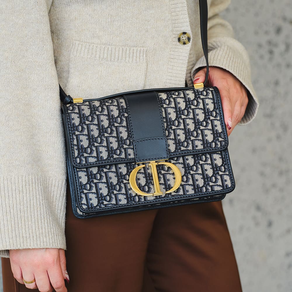 the original dior 30 montaigne flap on-figure in the blue oblique pattern by FASHIONPHILE