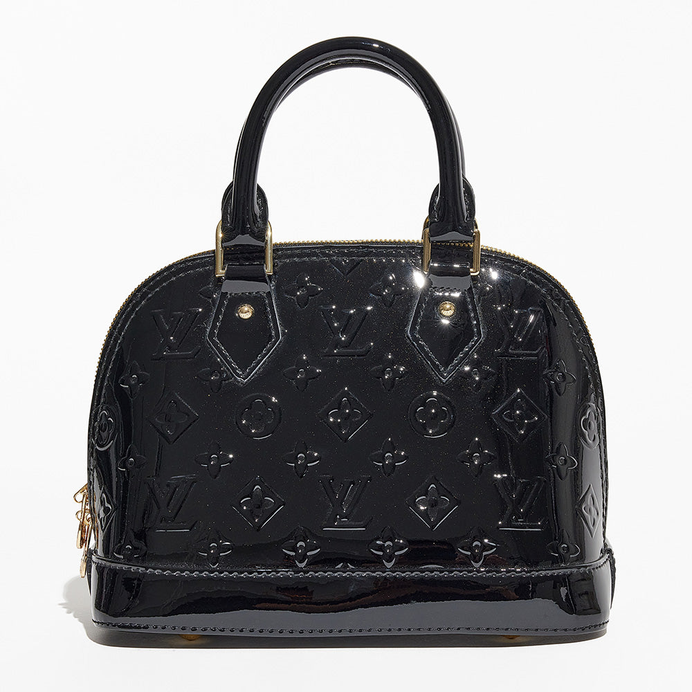 this is an image by FASHIONPHILE of a fake louis vuitton alma bag in black vernis