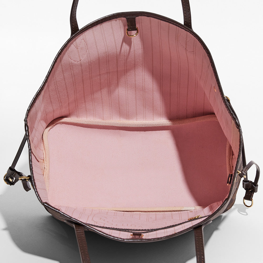 this is an image showing the inside view of a fake damier ebene louis vuitton neverfull bag's interior lining by fashionphile