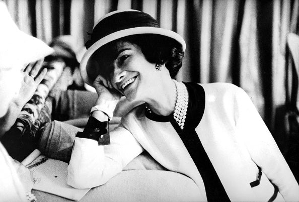 black and white photo of gabrielle coco chanel by FASHIONPHILE